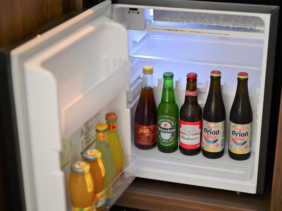 Ryukyu Hotel & Resort Nashiro Beach Itoman Exterior photo A small refrigerator with beer bottles